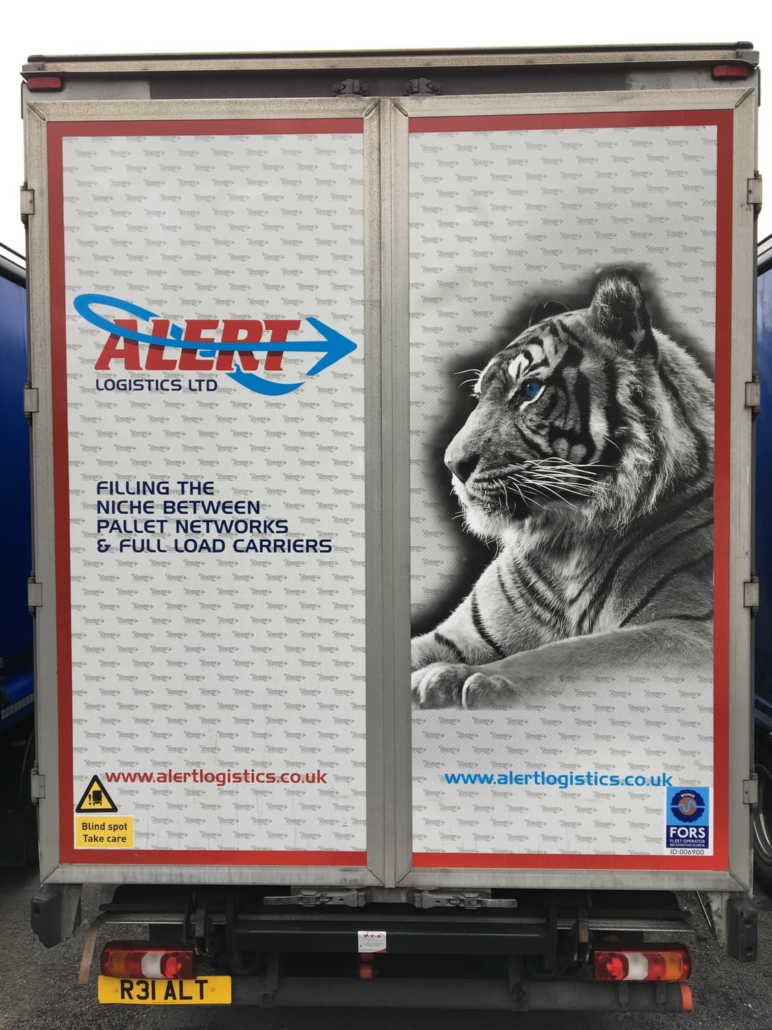 Truck cab with leopard, tiger and lion livery