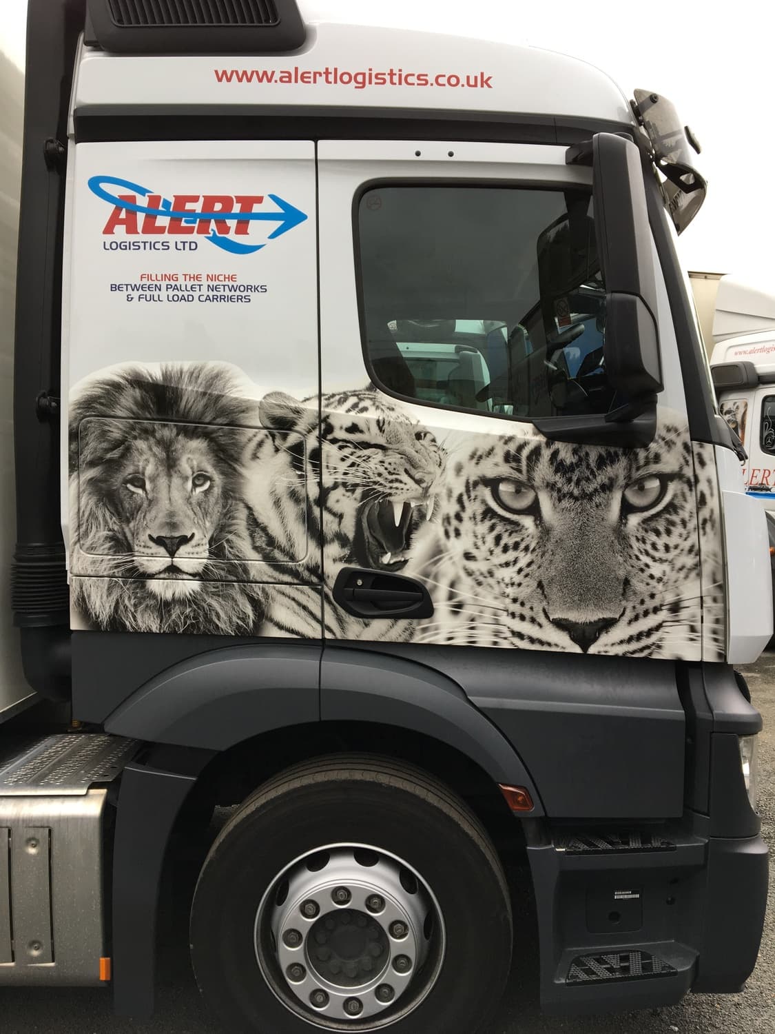 Truck cab with leopard, panther and wolf livery