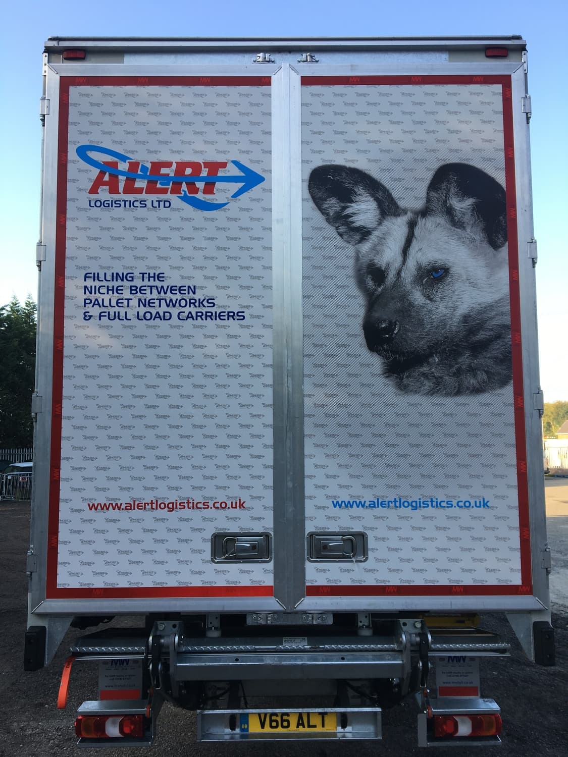 Rear of truck with red fox panel