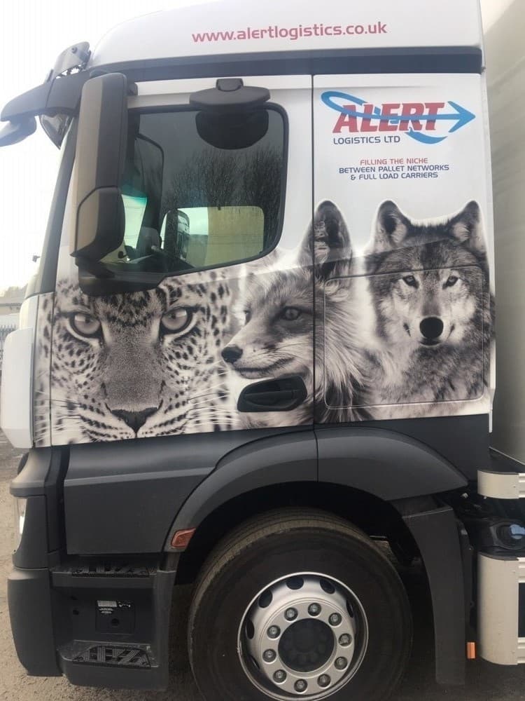 Truck cab with wolf, bear and leopard livery